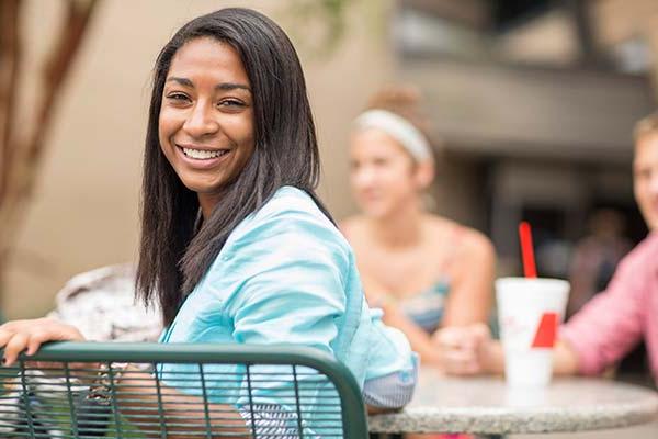 students outside on the commons patio